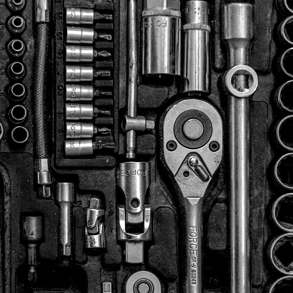 Close-up of a torque wrench and various heads and sockets